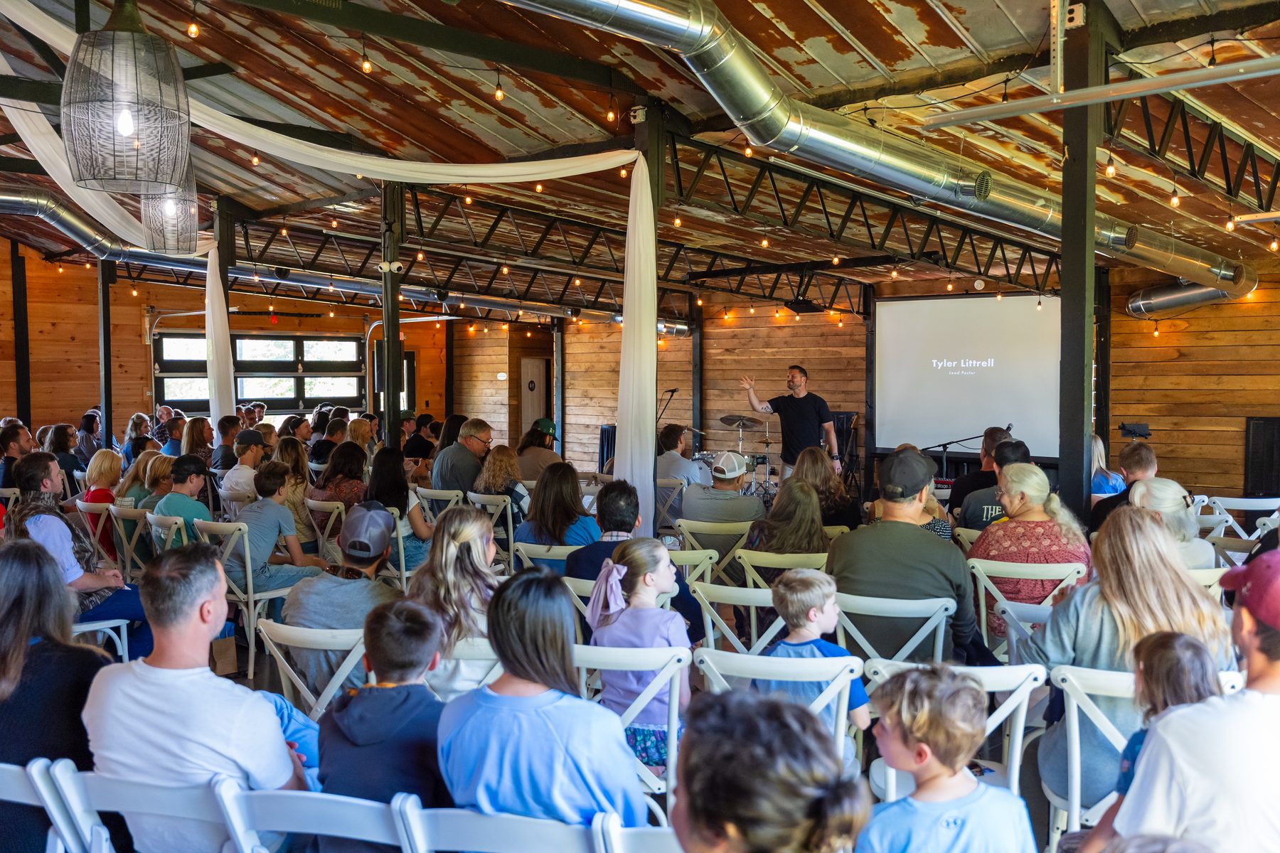 Church gathering with a pastor teaching